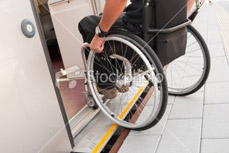 Male wheelchair user boarding the tube. Transitional Rehabilitation, moving back into the community. 