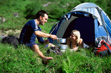 Couple making food while camping. Physical Neurological Assessment including Physical and Cogntive.