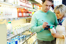 Couple checking list as they shop. Neuro rehab Programmes to help with everyday activites.