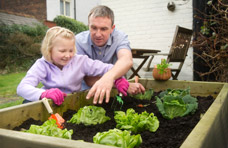 Male gardening with daughter - Neuro rehab engagement activities.